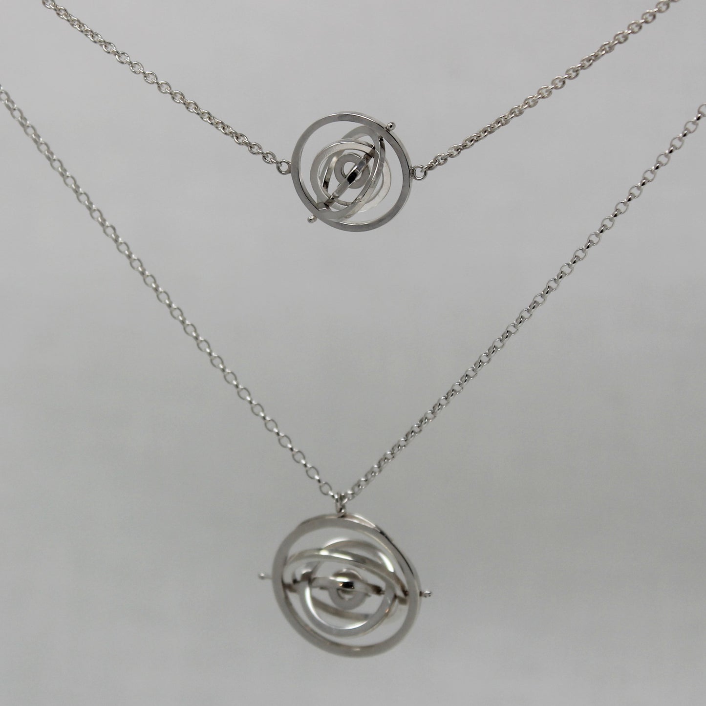Kinetic recycled sterling silver choker and necklace each with 5 square wire concentric circle rings spinning on central pin