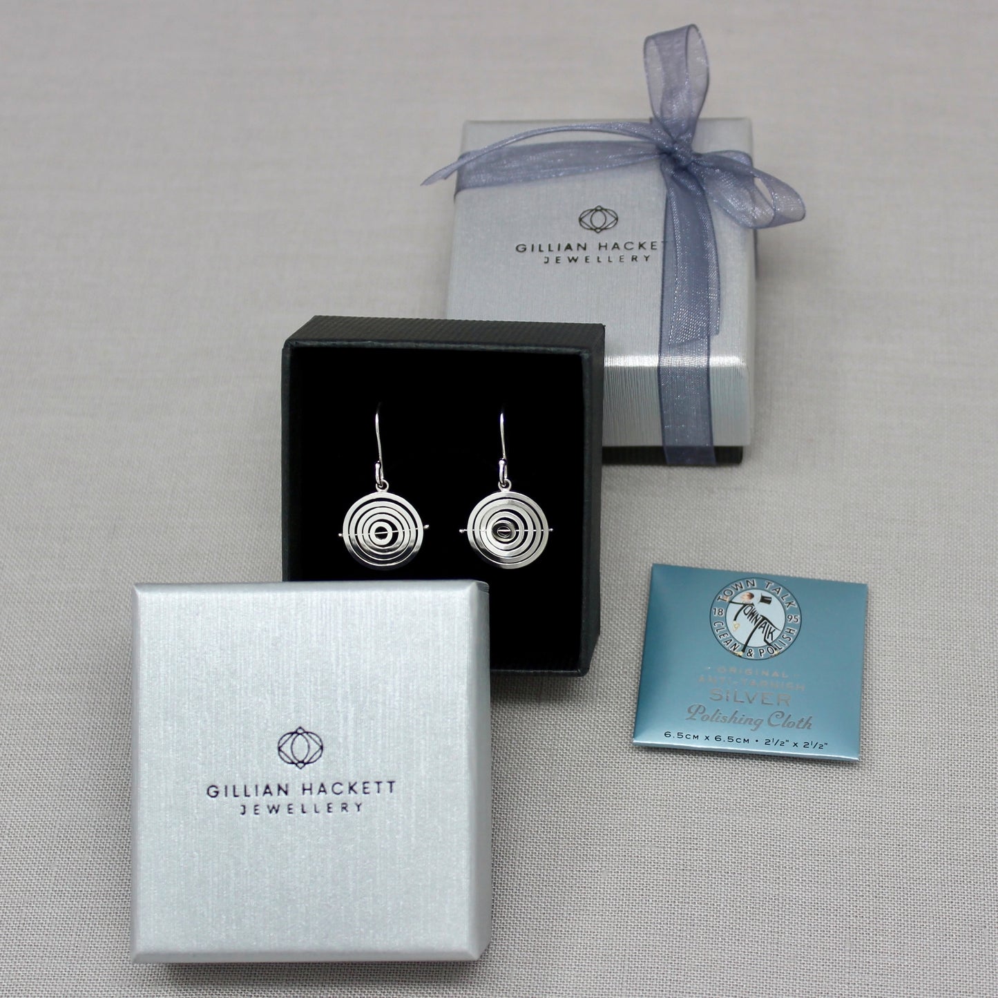 Intricate sterling silver kinetic dangly earrings in Gillian Hackett Jewellery luxury black gift box with grey textured lid