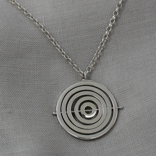 Hallmarked silver kinetic pendant with 5 concentric circle recycled wire rings held by central pin with chunky belcher chain