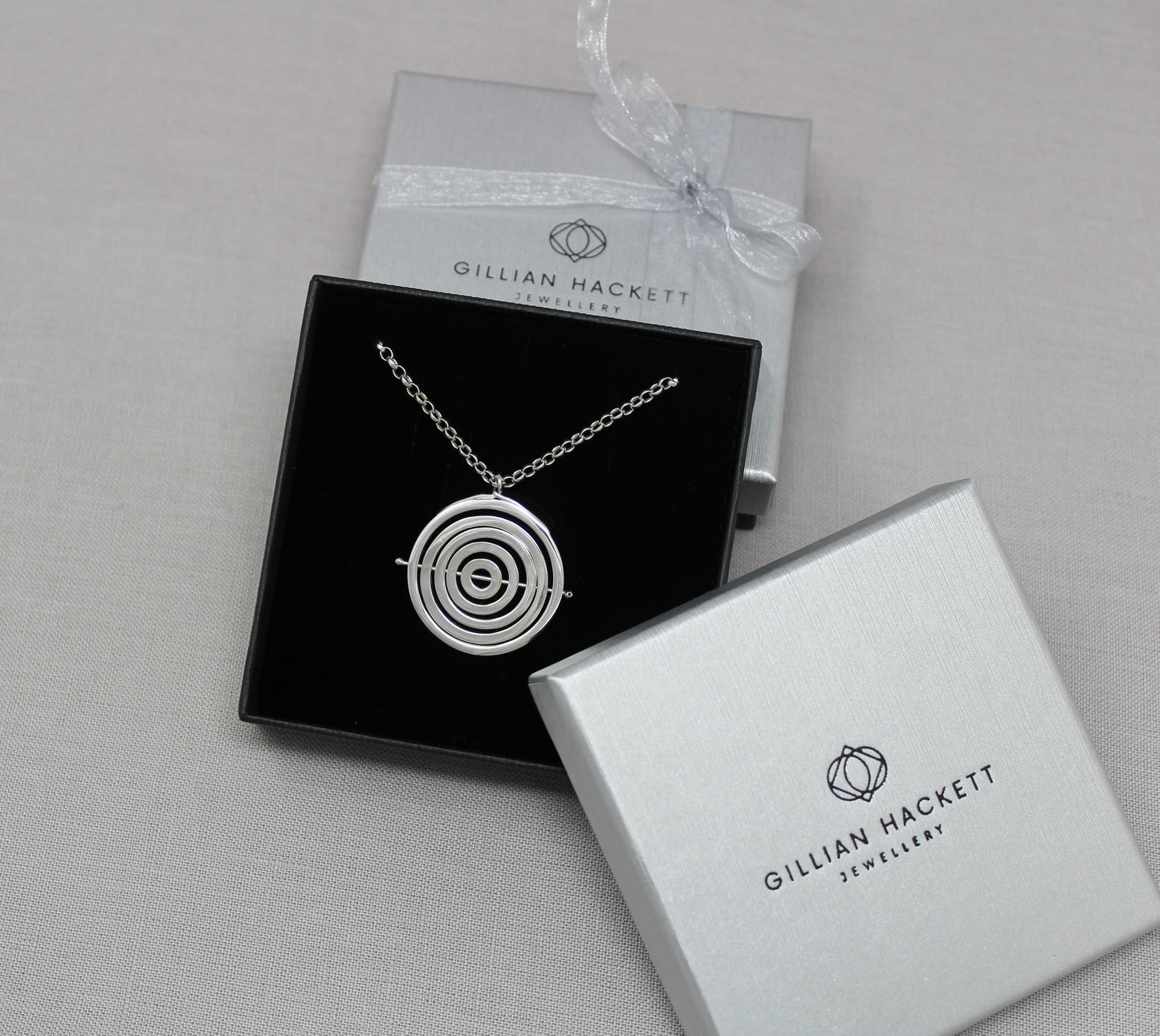 Hallmarked silver kinetic pendant in luxury black gift box & grey textured lid embossed with Gillian Hackett Jewellery & logo