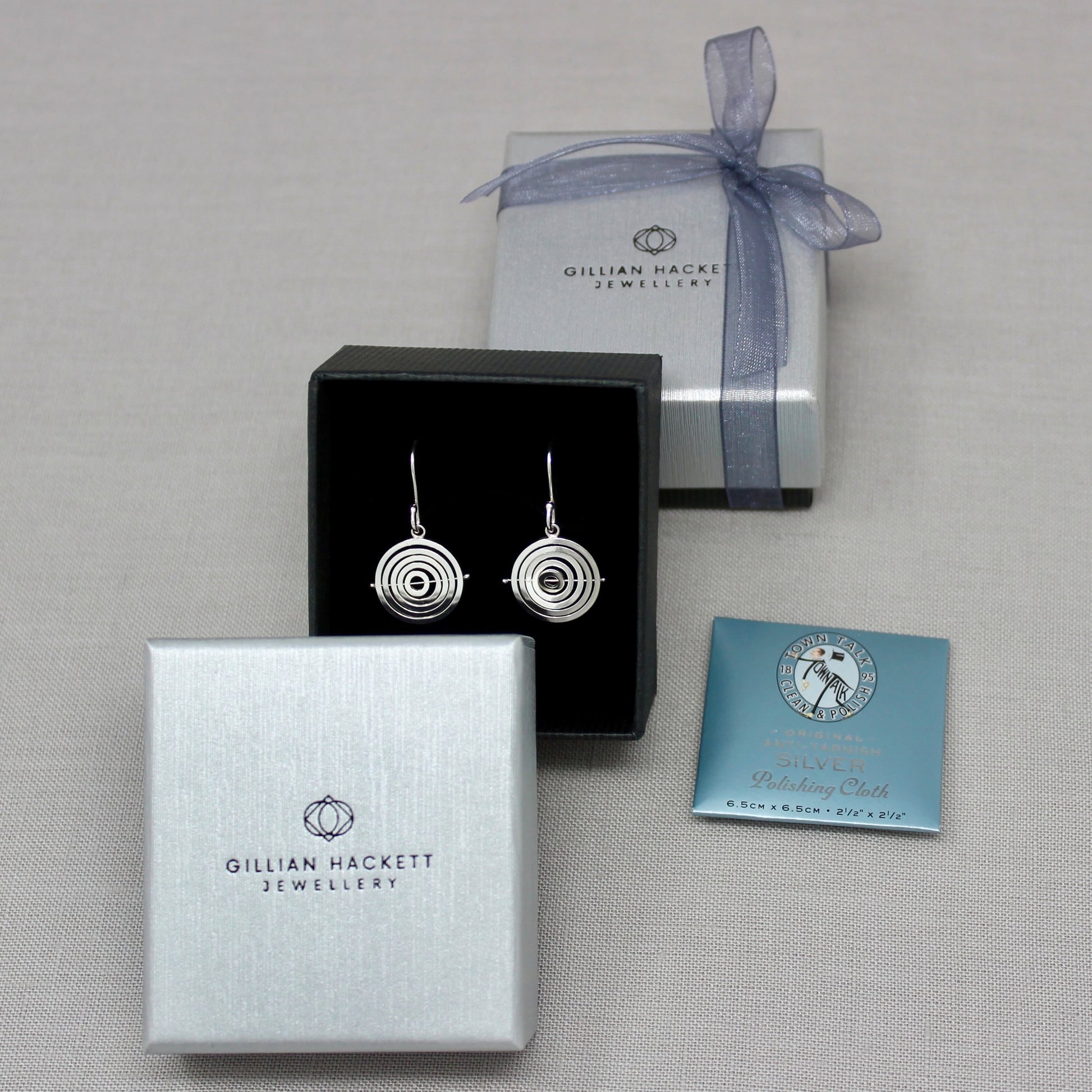 Intricate sterling silver kinetic dangly earrings in Gillian Hackett Jewellery luxury black gift box with grey textured lid