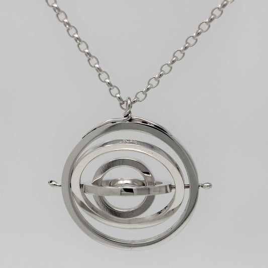 Sterling silver kinetic necklace 2.2cm wide with 5 concentric circle rings pivoting on central pin hanging from belcher chain